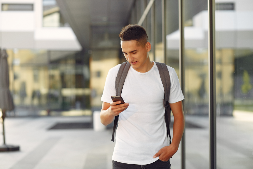 student in a university campus with a phone 2023 11 27 04 58 18 utc